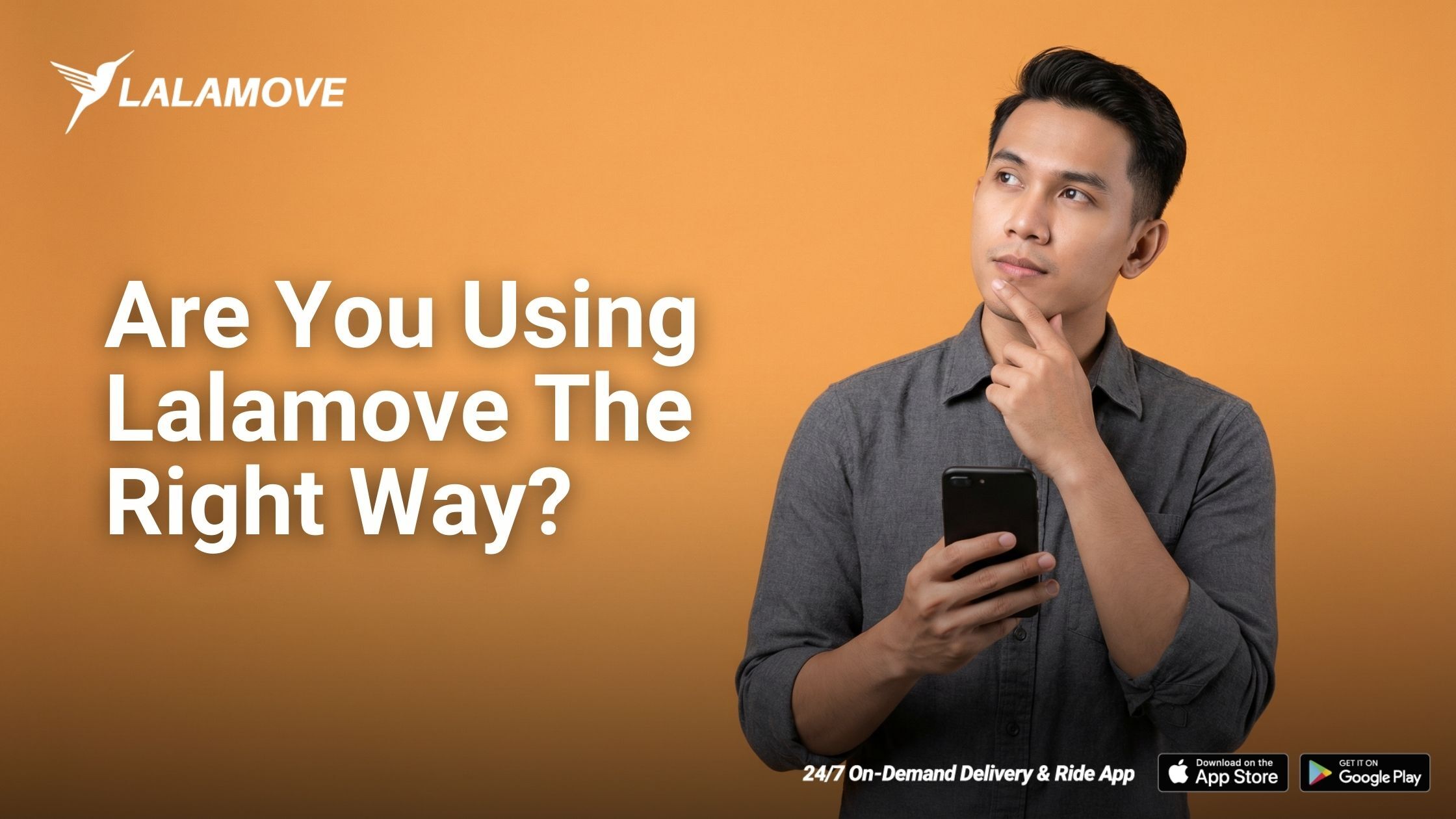 Young Malaysian adult standing against a plain orange background, holding a smartphone and looking thoughtfully at it, positioned on the right side of the frame, with empty space on the left for t (1)